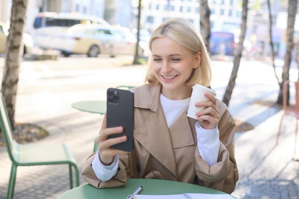 Adult chatting online while having coffee